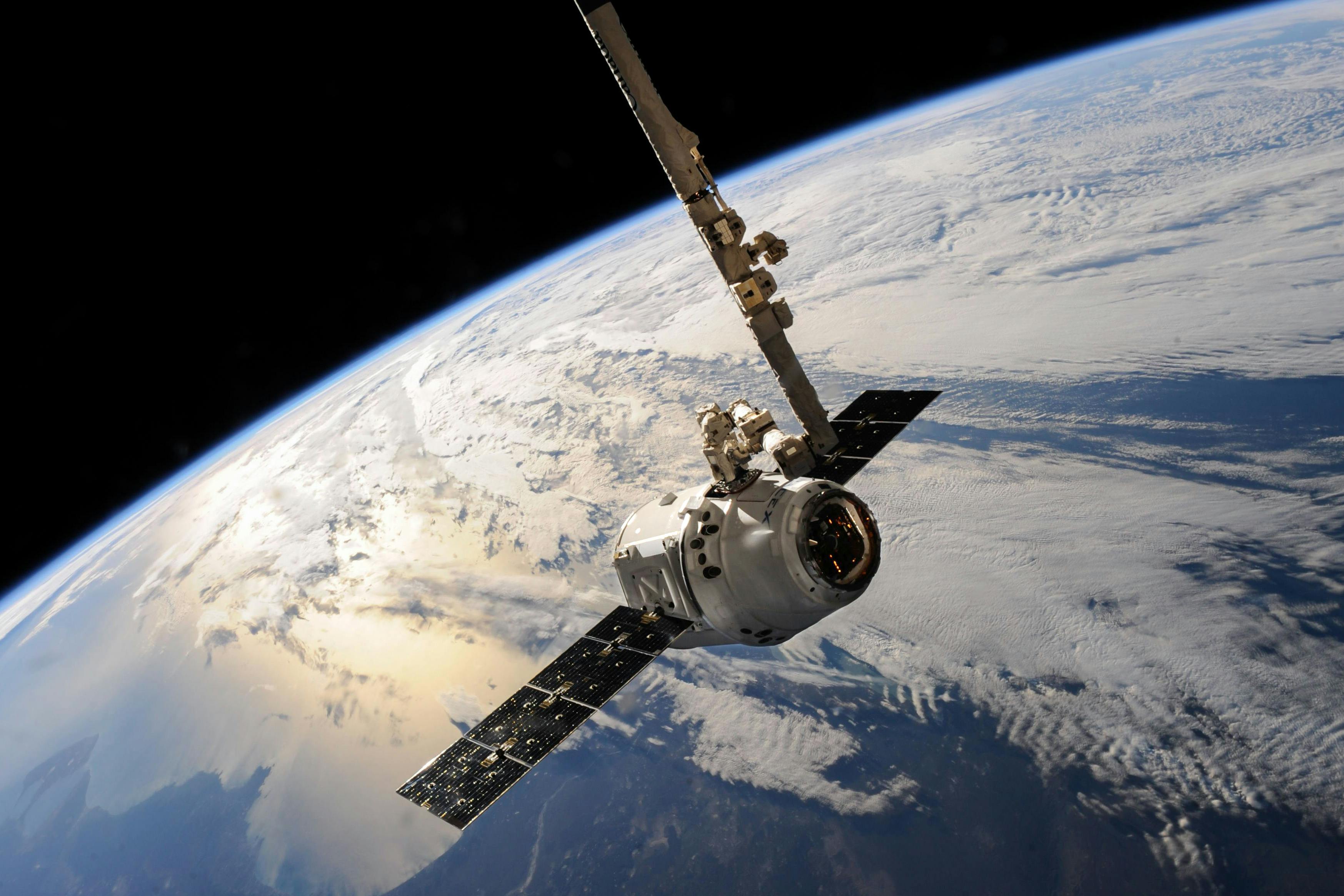 Satellite in space with blue earth in view