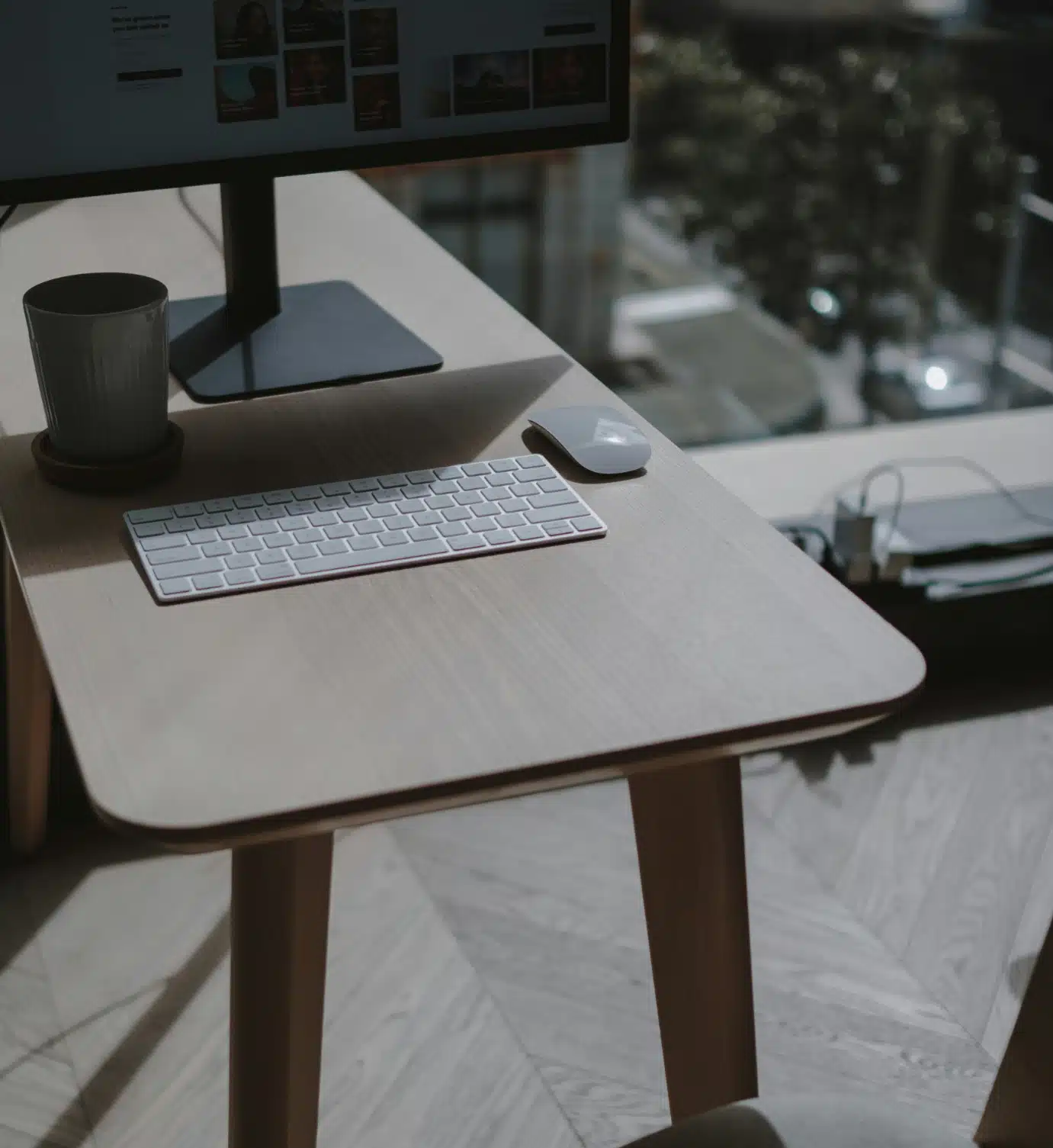 computer on a desk in a contemporary apartment overlooking the city streets computer on a desk in a contemporary apartment overlooking the city streets