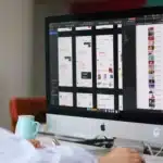 silver imac on brown wooden table