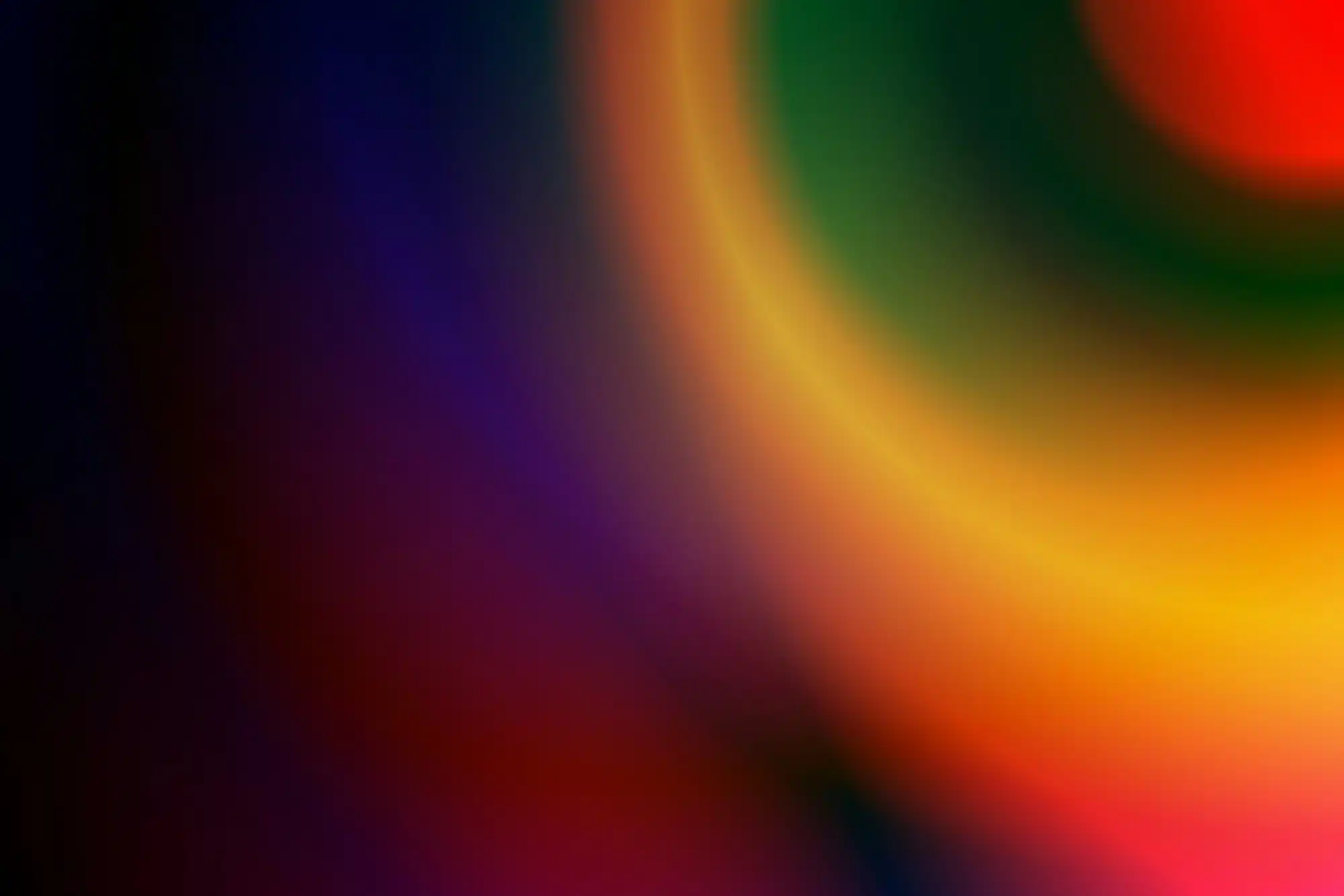 a-blurry-image-of-a-multicolored-background