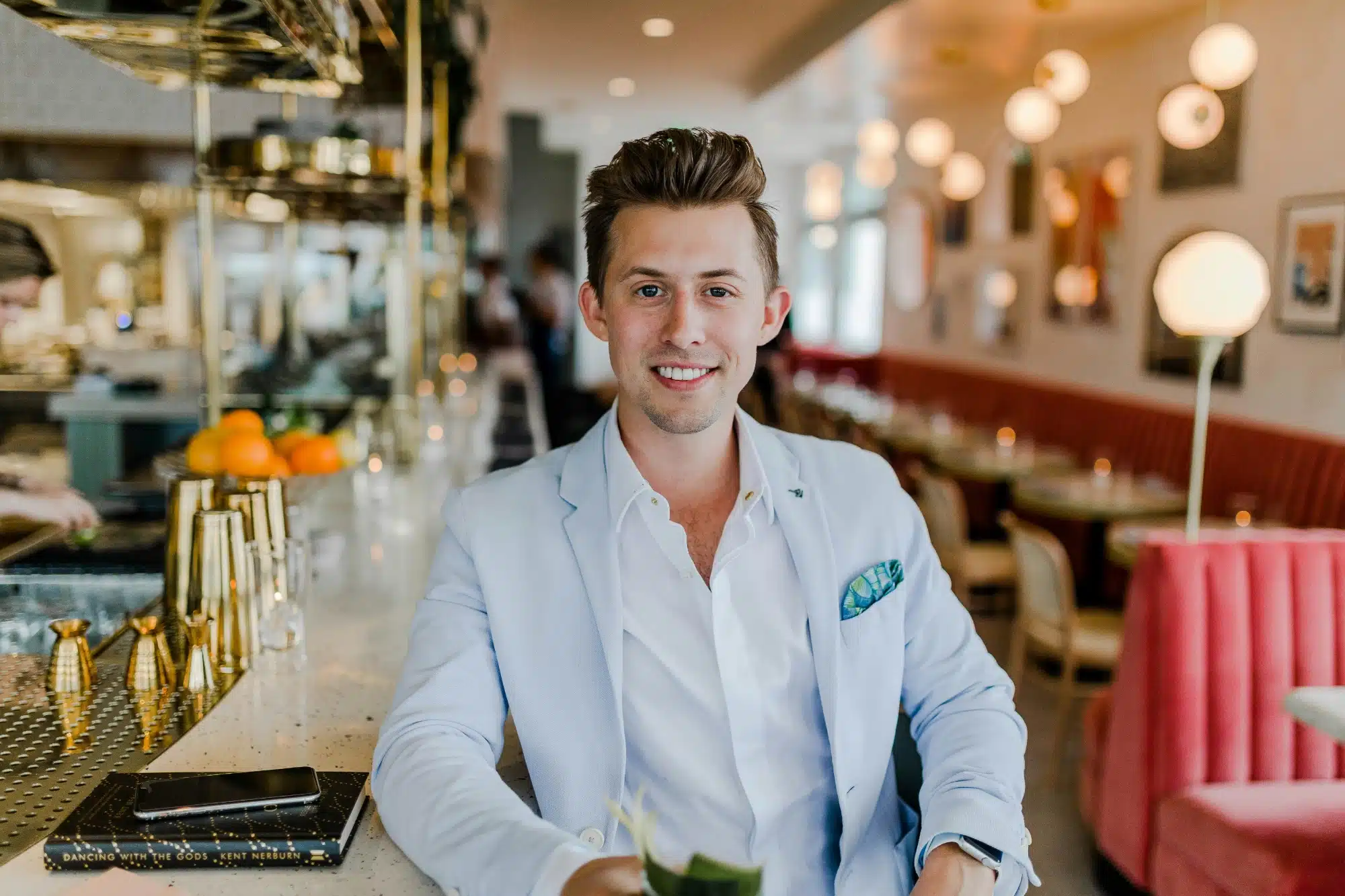 man wearing blue coat in restaurant man wearing blue coat in restaurant